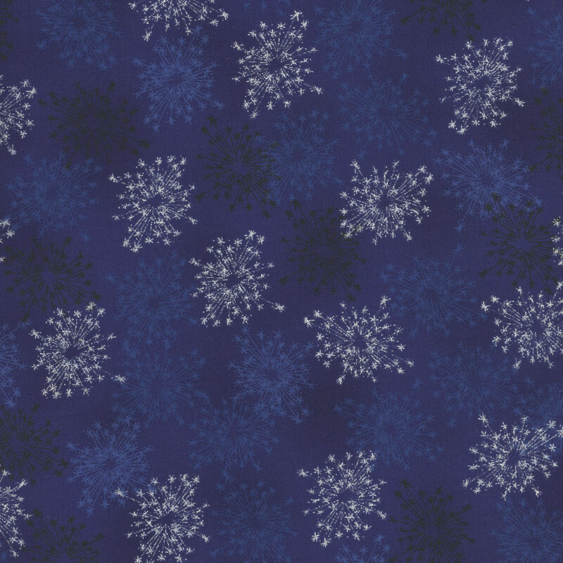 beautiful deep blue fabric with scattered metallic silver and tonal starbursts