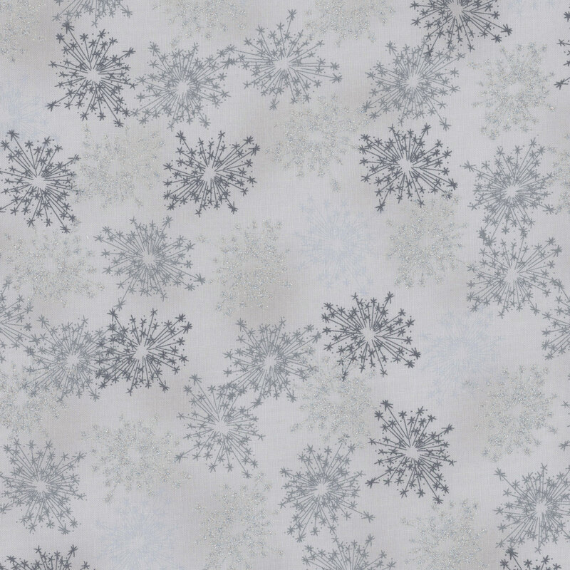 beautiful light gray fabric with scattered metallic silver and tonal starbursts