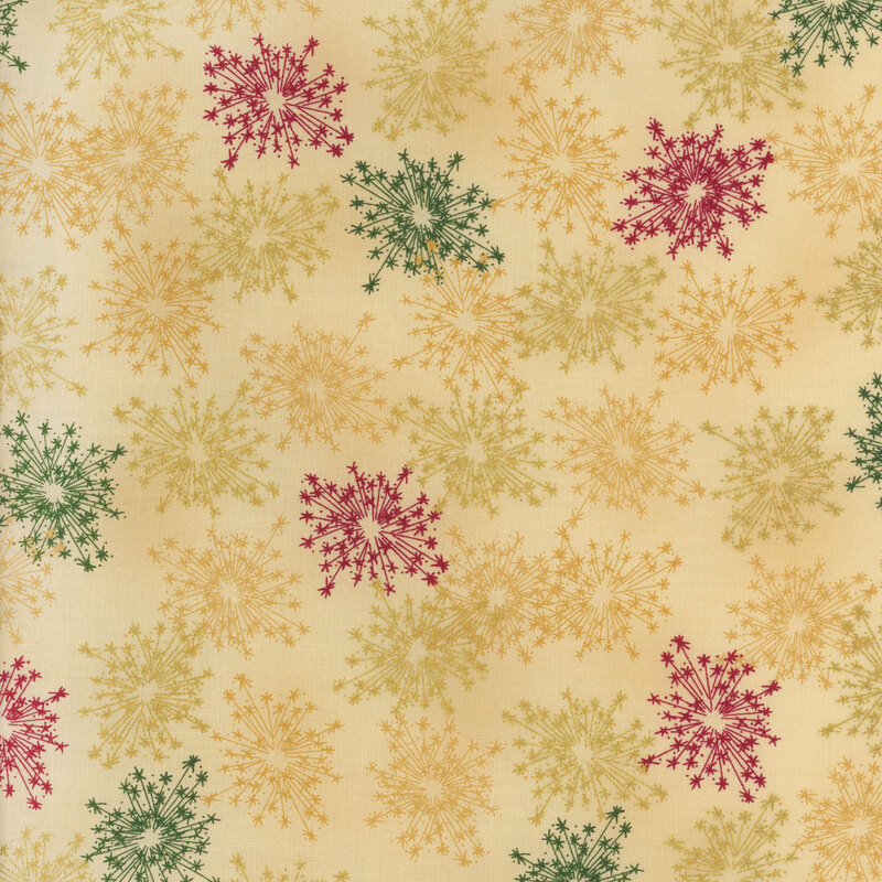beautiful warm tan fabric with scattered metallic gold, golden yellow, dark green, and red starbursts