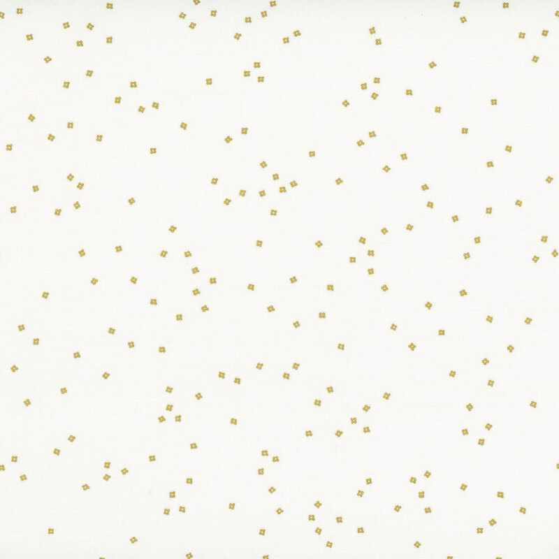 Small metallic gold blossoms scattered on a white background fabric