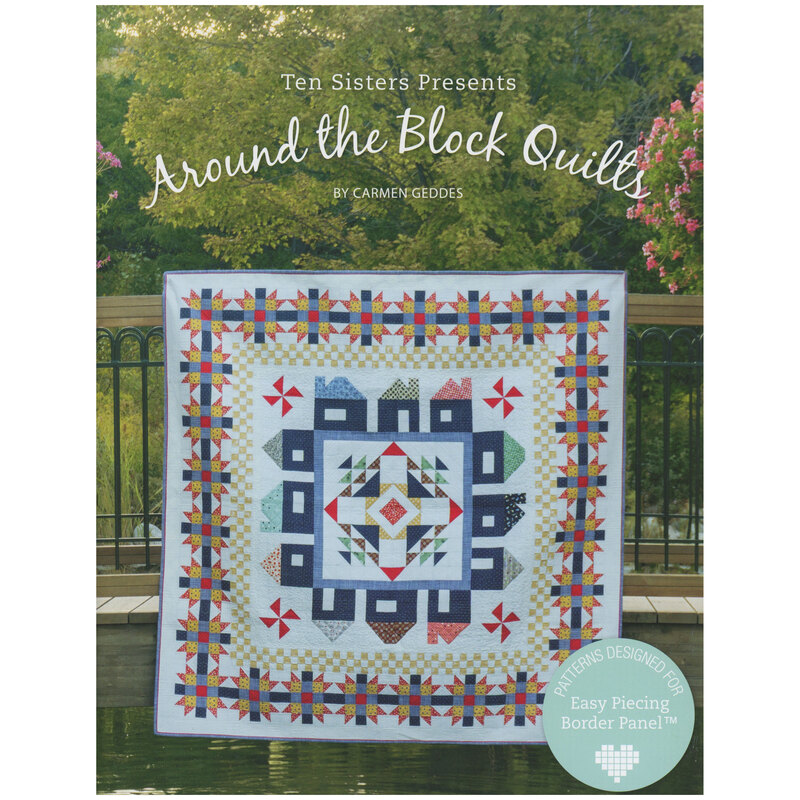 Front of pattern showing a completed square quilt staged on a bridge over water, lush greenery in the background