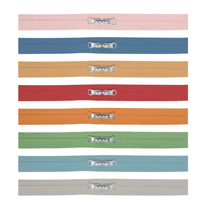 The eight zippers that come in the set, isolated on a white background. Order of colors is as follows: baby pink, cadet blue, ocher, poppy red, orange, sage green, teal, and gray.