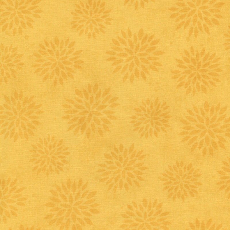 Yellow fabric with a floral pattern featuring flower shapes in lighter shades.