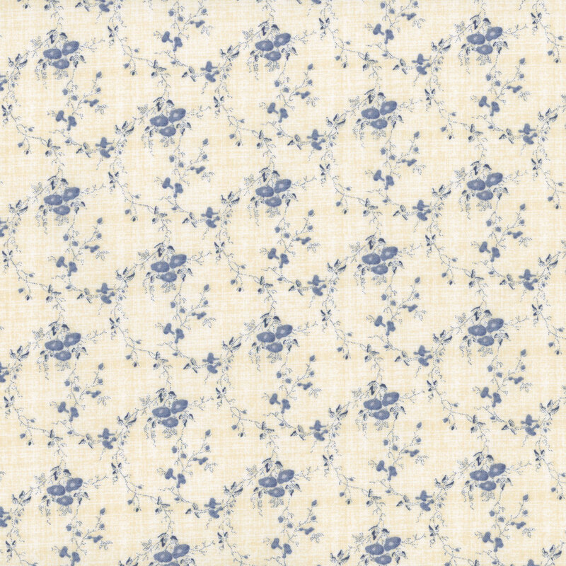 off white textured fabric featuring scattered textured denim blue vines and small flower bunches