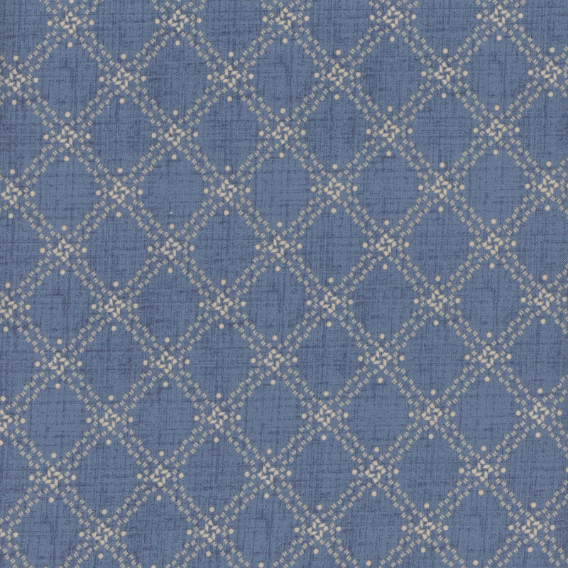 denim blue textured fabric featuring a textured cream lattice pattern