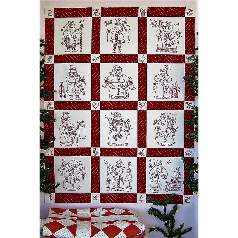 The completed Here Comes Santa quilt, staged with pine saplings. 