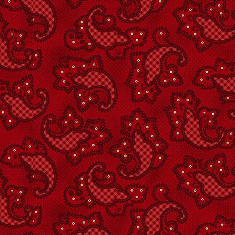 Red fabric with embellished paisley motifs with gingham details.