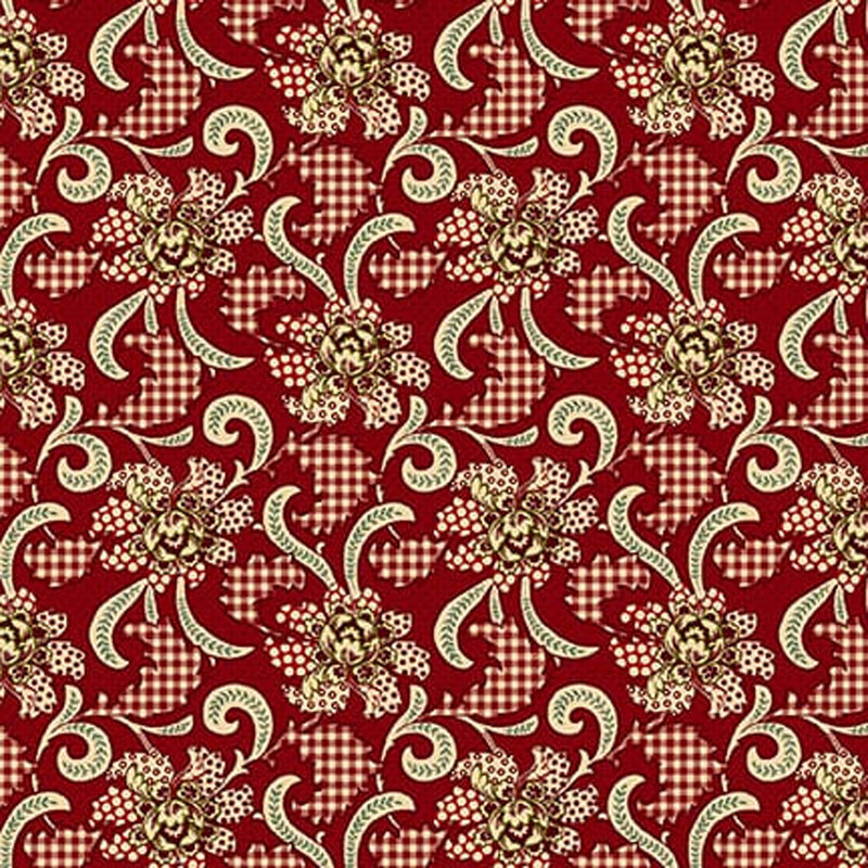 Red fabric with cream filigree and red gingham patches.