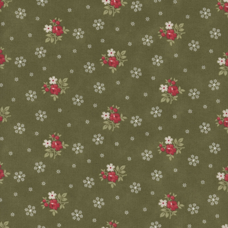 This green fabric features bunches of red and cream flowers with white snowflakes all evenly spaced apart