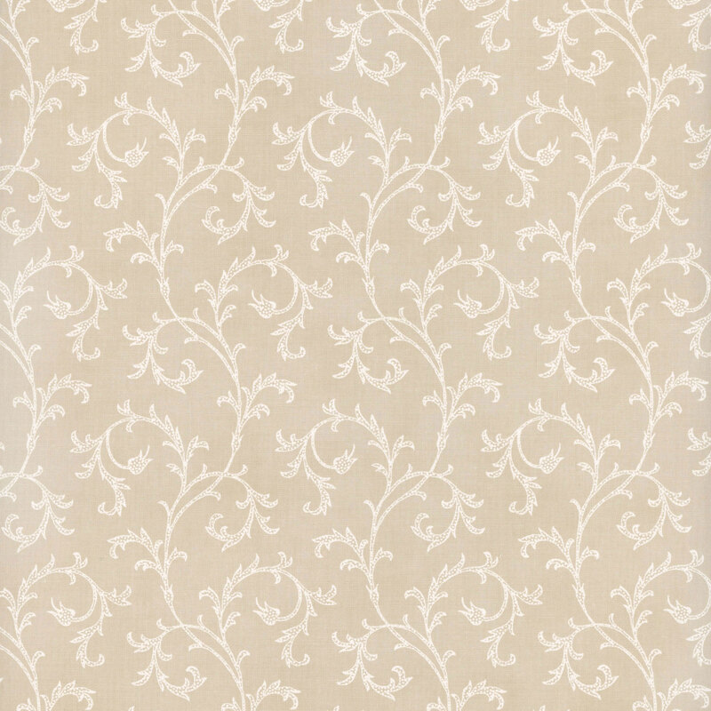 This fabric features elegant white filigree that curls across a beige background