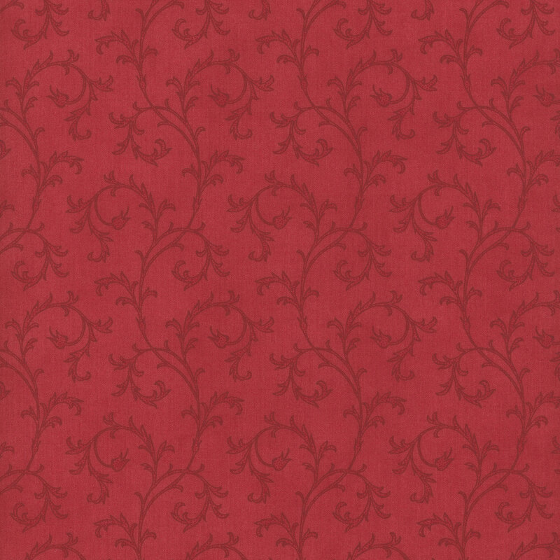 This fabric features elegant tonal filigree that curls across a red background