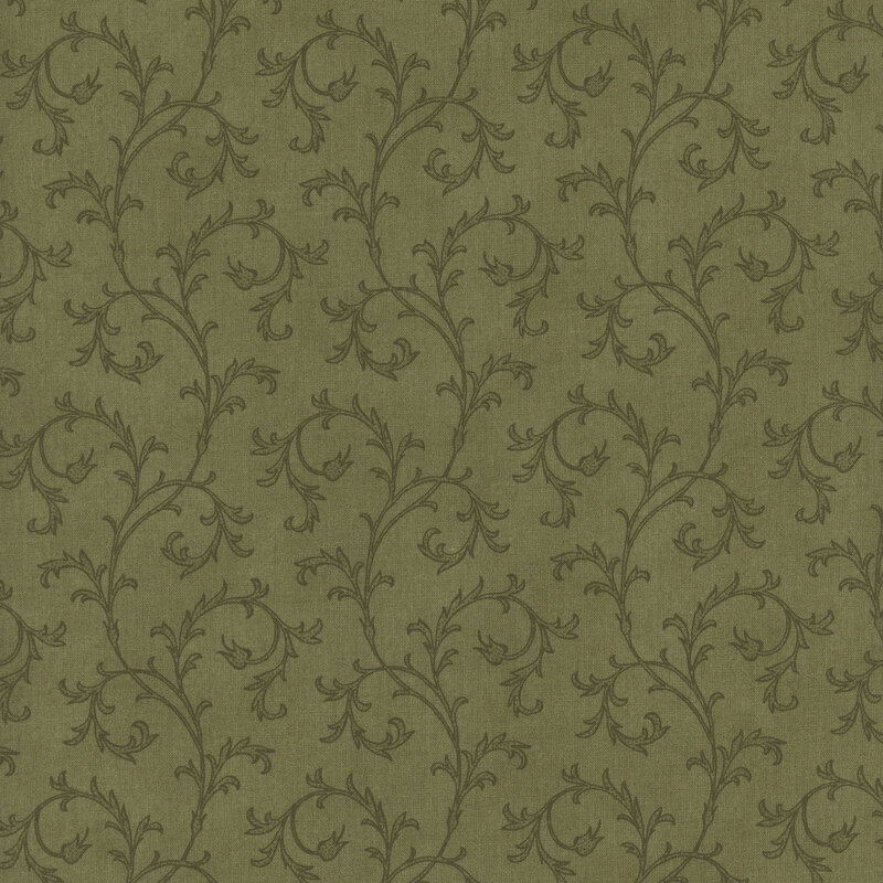This fabric features elegant tonal filigree that curls across a green background