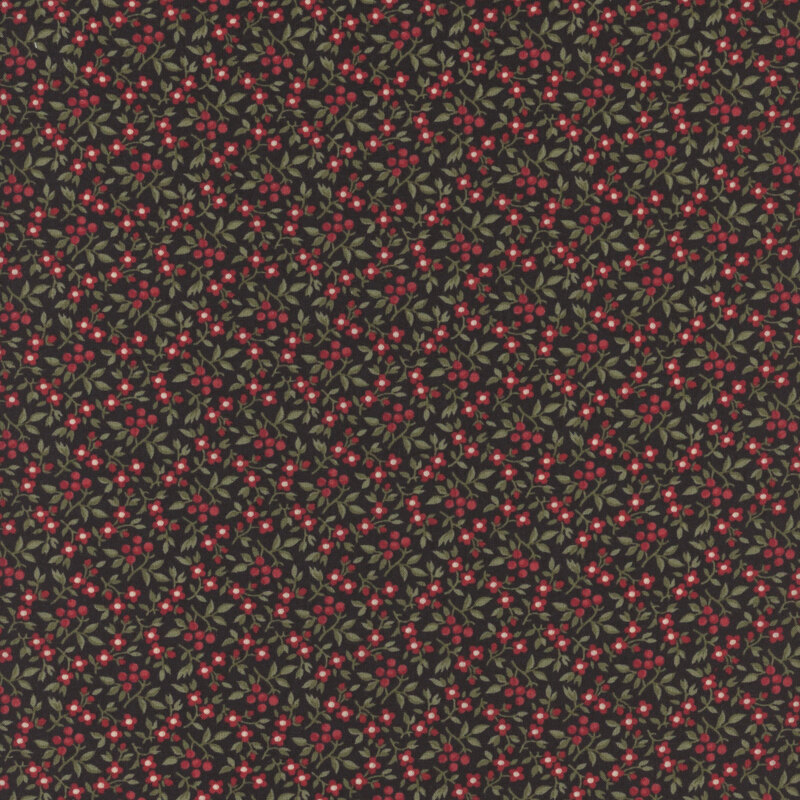 This fabric features small red flowers and green leaves crowded on a black background
