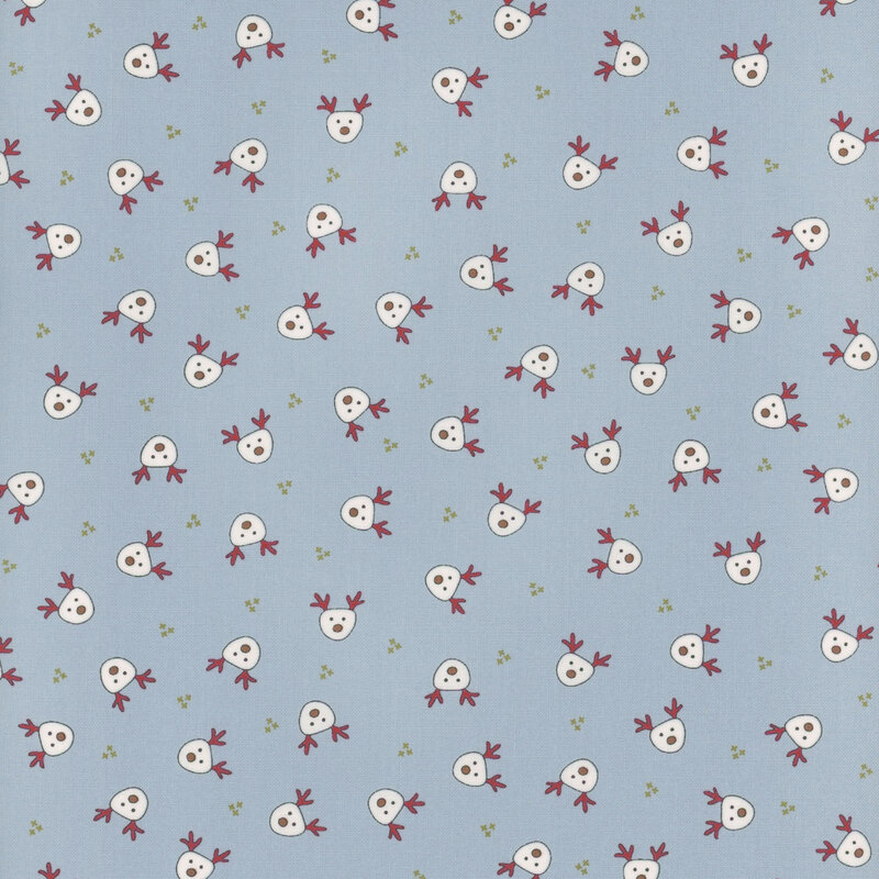 This light blue fabric features small white illustrated reindeer heads evenly spaced and tossed all over.