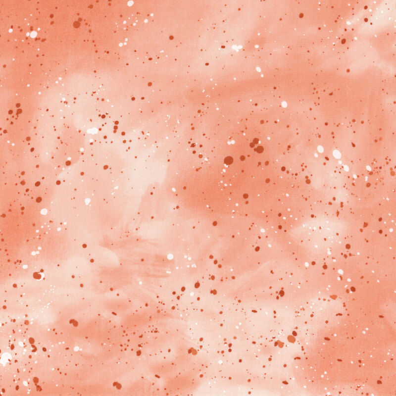 This coral and white mottled fabric features darker tonal splatters all over