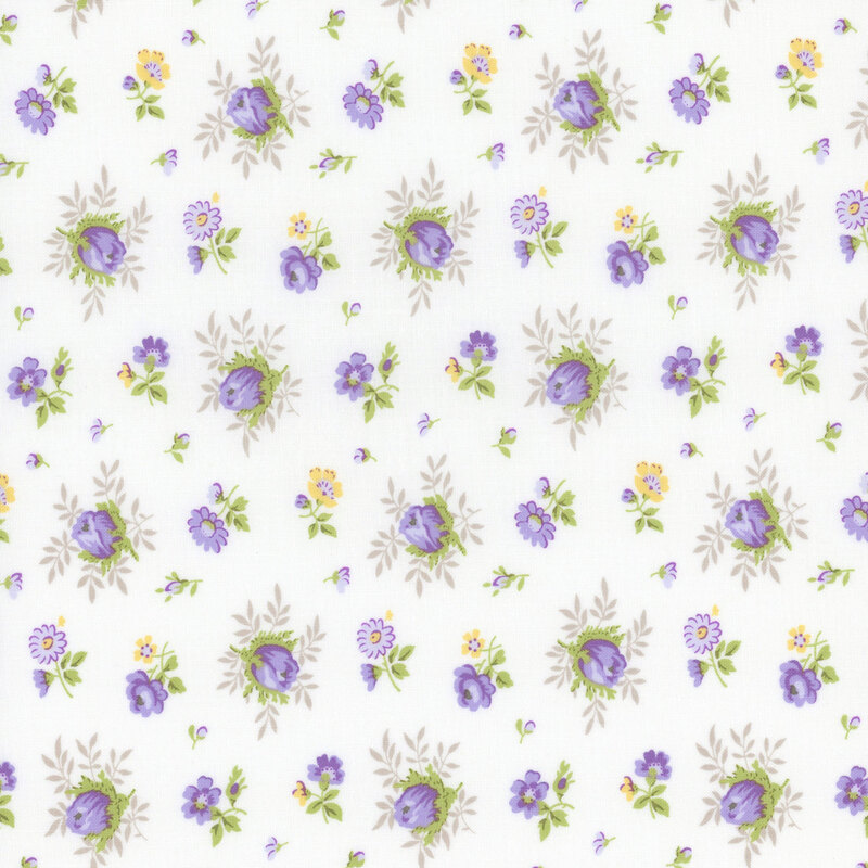 off white fabric with scattered medium and small purple and yellow florals