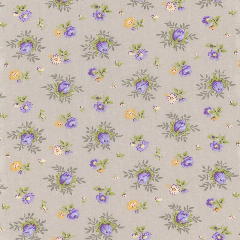 taupe fabric with scattered medium and small purple and yellow florals