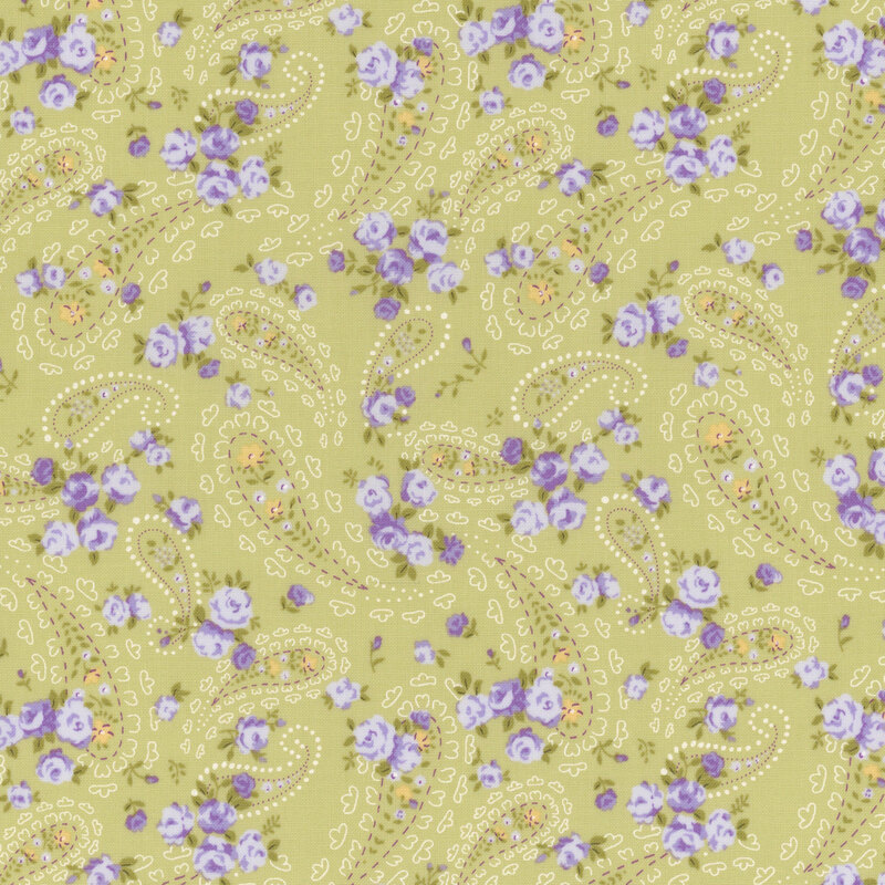soft green fabric with scattered intricate off white paisley motifs, amidst small light purple and yellow florals