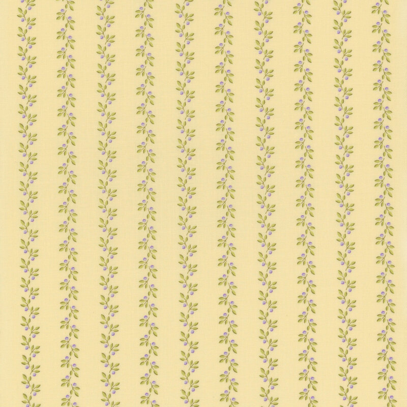 pale yellow fabric with stripes of leafy vines accented by small purple flower buds