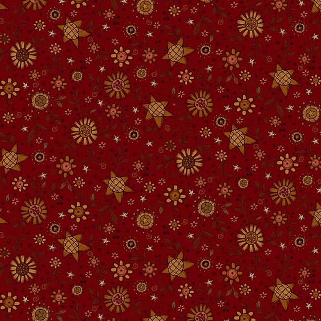maroon fabric featuring leaves, flowers, and stars
