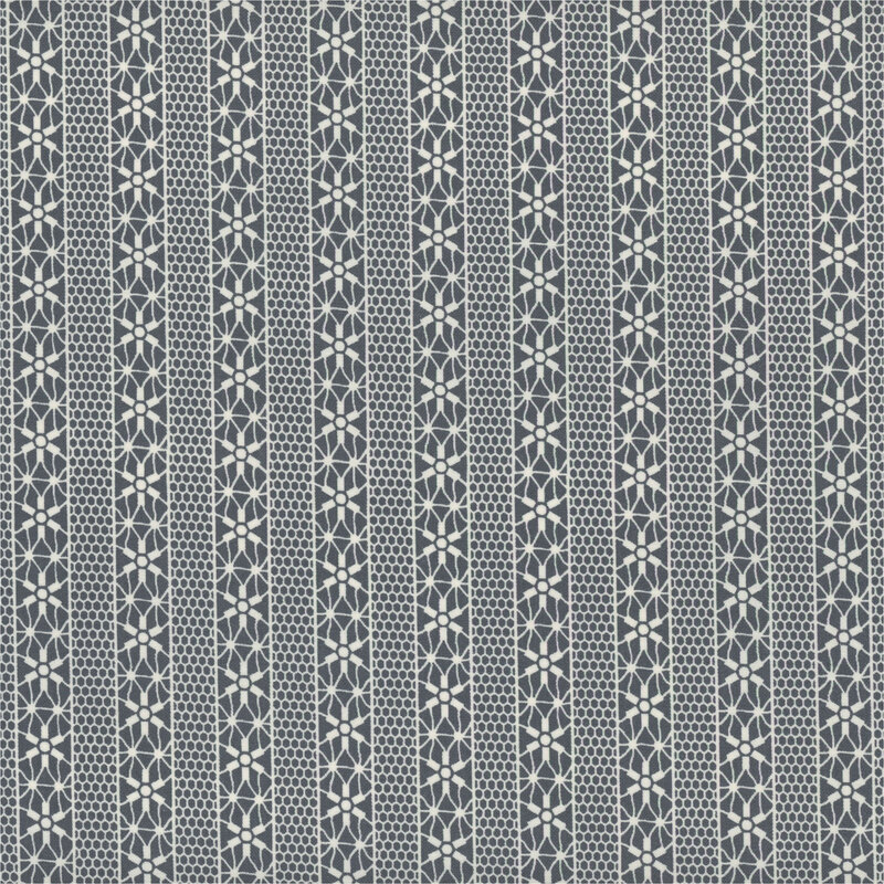 muted blue fabric with off white striped lace motifs