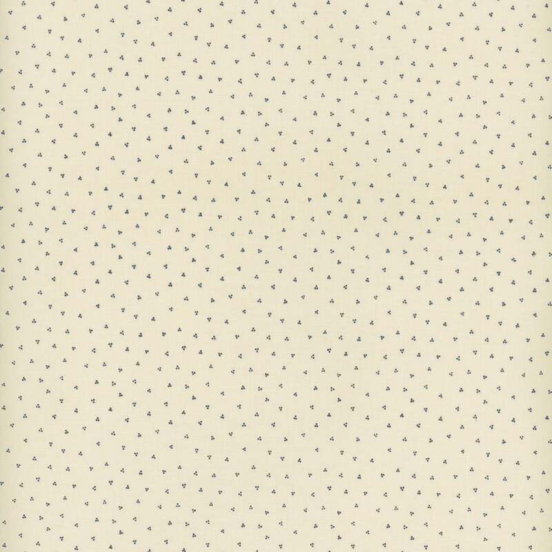 off white fabric with scattered navy blue clusters of dots