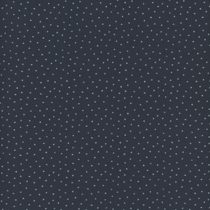 navy blue fabric with scattered white clusters of dots