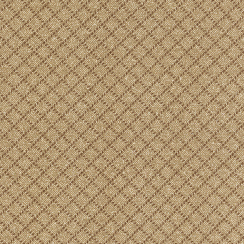 light brown flannel fabric featuring small tonal dashes making a lattice design