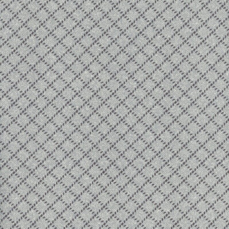 cool gray flannel fabric featuring small dark gray dashes making a lattice design
