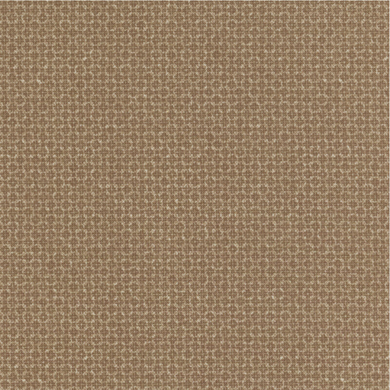 soft brown flannel fabric featuring packed together tonal squares and crosses