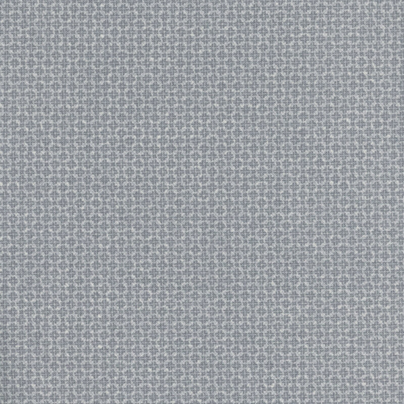light gray flannel fabric featuring packed together tonal squares and crosses