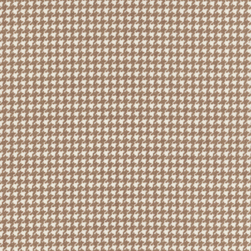cream flannel fabric featuring a small brown houndstooth pattern