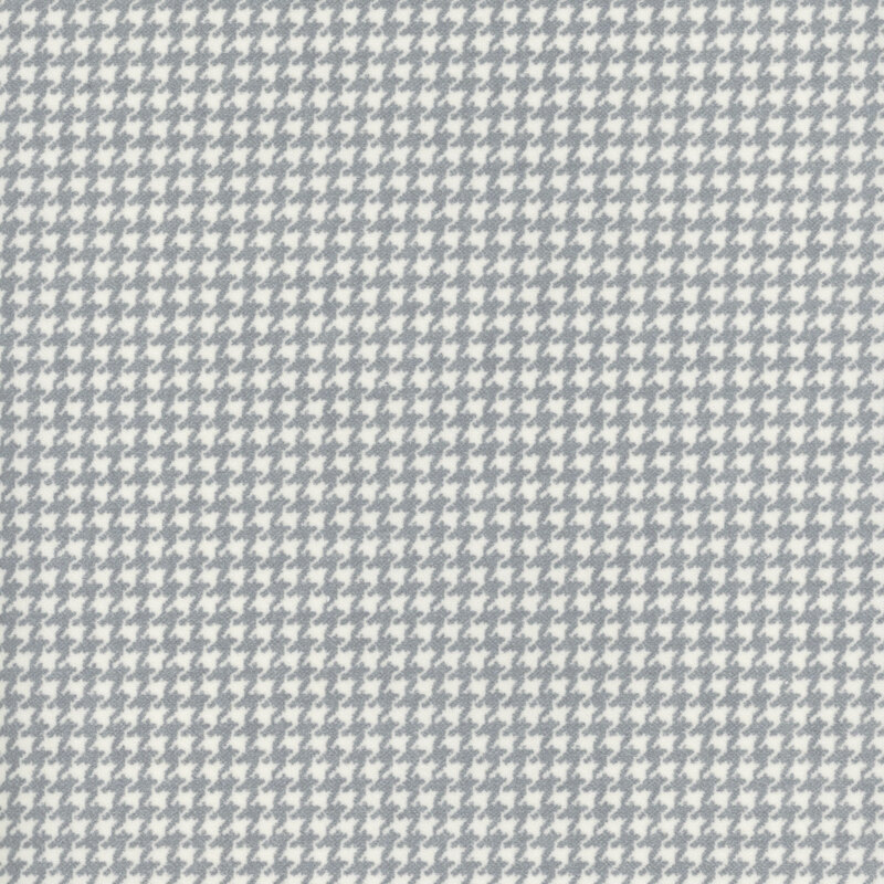 cream flannel fabric featuring a small light gray houndstooth pattern
