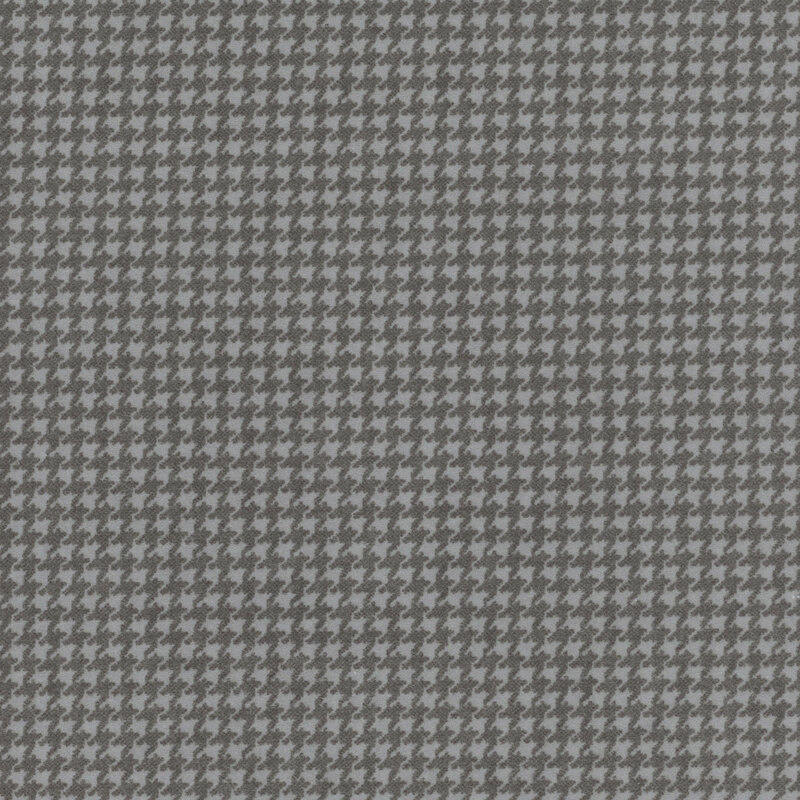 light gray flannel fabric featuring a small dark gray houndstooth pattern