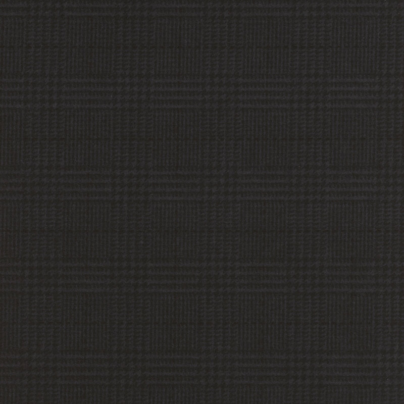 charcoal flannel fabric featuring a black plaid design, including dashed lines and houndstooth elements