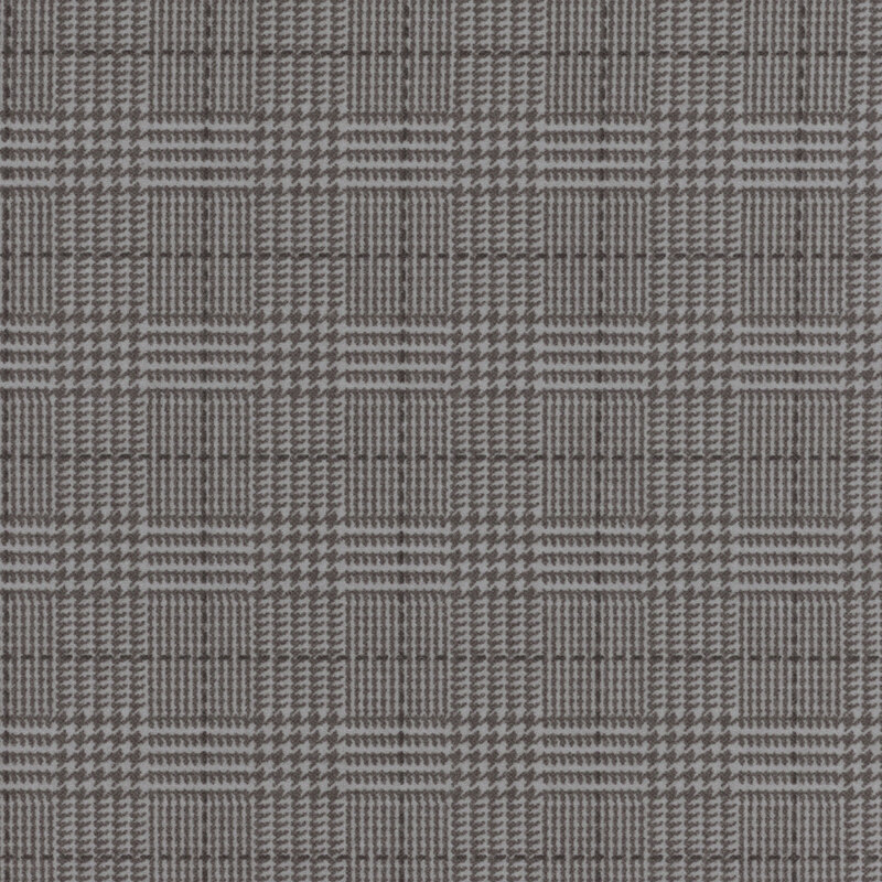 gray flannel fabric featuring a dark gray plaid design, including dashed lines and houndstooth elements