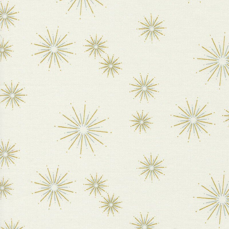 This cream fabric features gold metallic starbursts in varying sizes dotted all over.