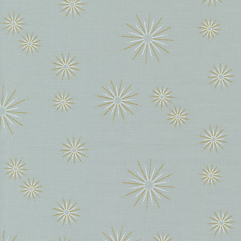 This light gray fabric features gold metallic starbursts in varying sizes dotted all over.