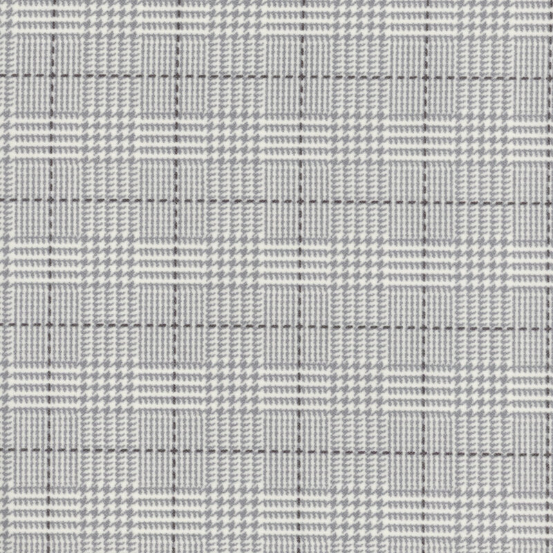 cream flannel fabric featuring a light gray plaid design, including dashed lines and houndstooth elements