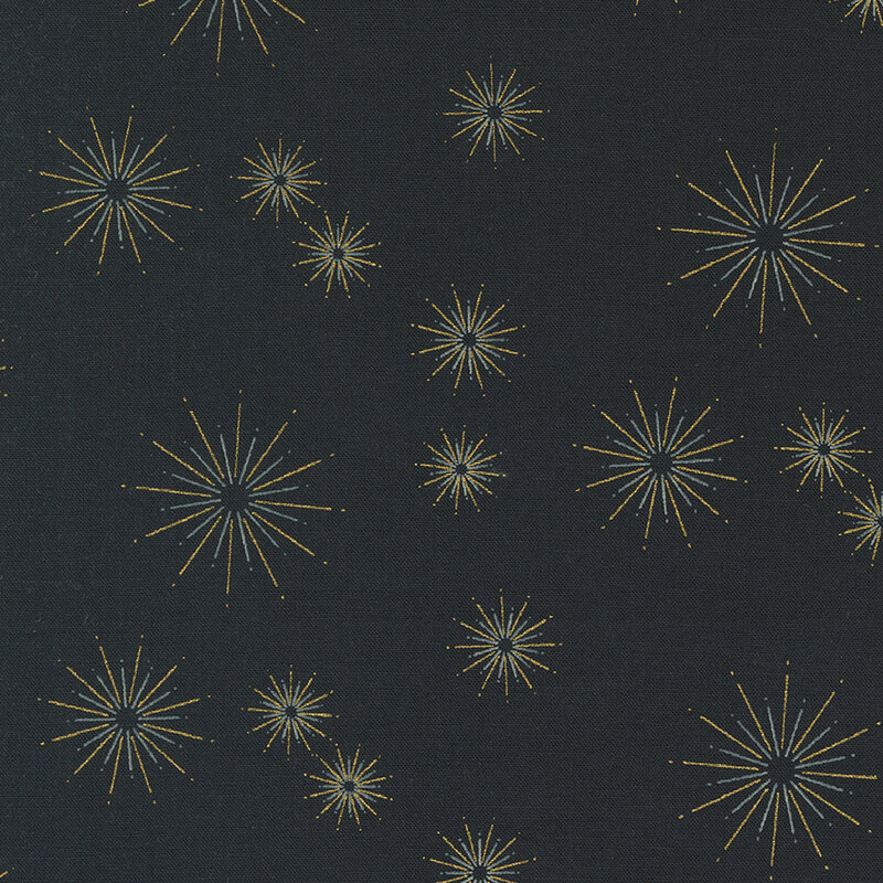 This black fabric features gold metallic starbursts in varying sizes dotted all over.