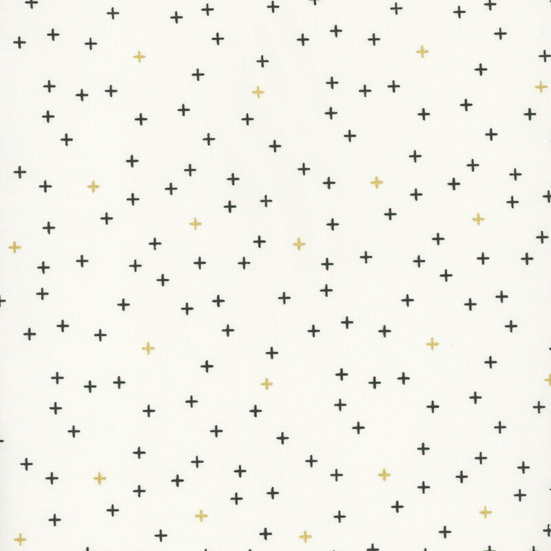 Simple cream fabric featuring tiny black and gold metallic crosses all over.