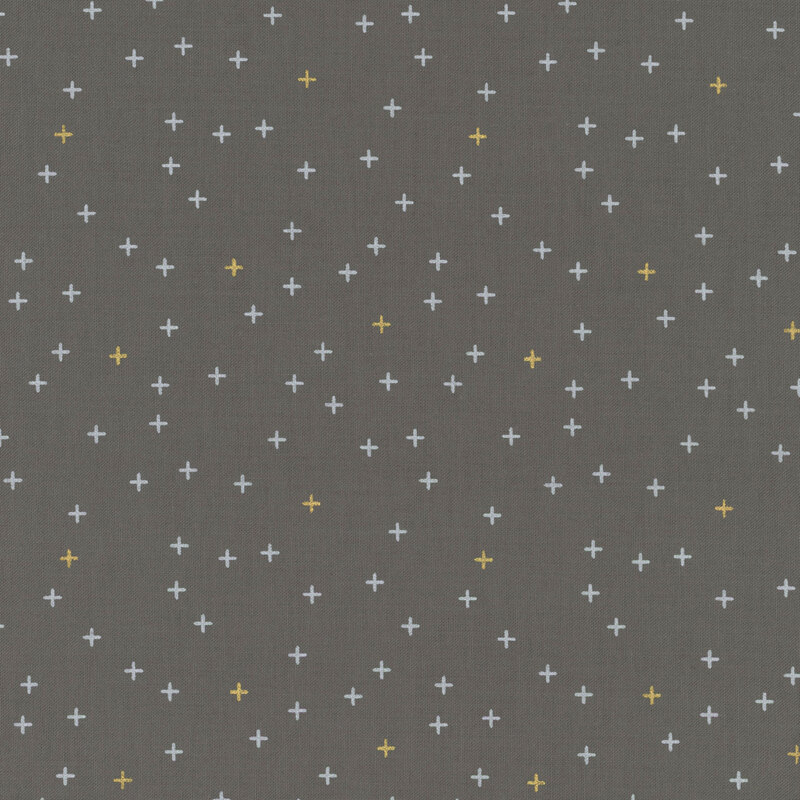 Simple dark gray fabric featuring tiny white and gold metallic crosses all over.