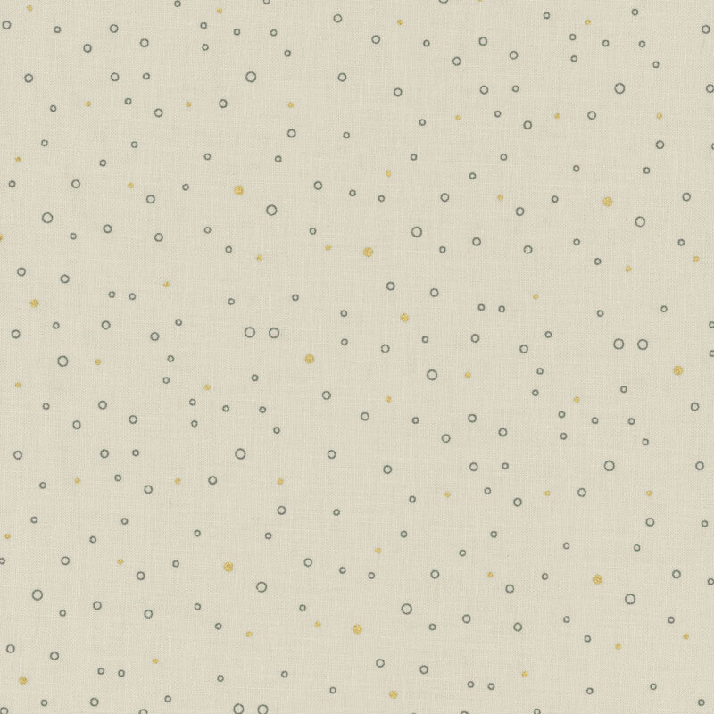 Ecru fabric featuring tiny gray circles and gold metallic dots scattered all over.