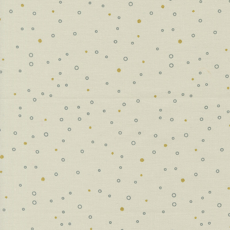 Ecru fabric featuring tiny gray circles and gold metallic dots scattered all over.