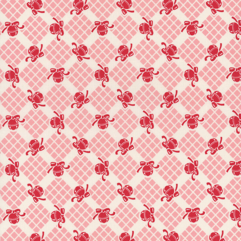 off white fabric featuring pink geometric elements with candy red bells scattered in between