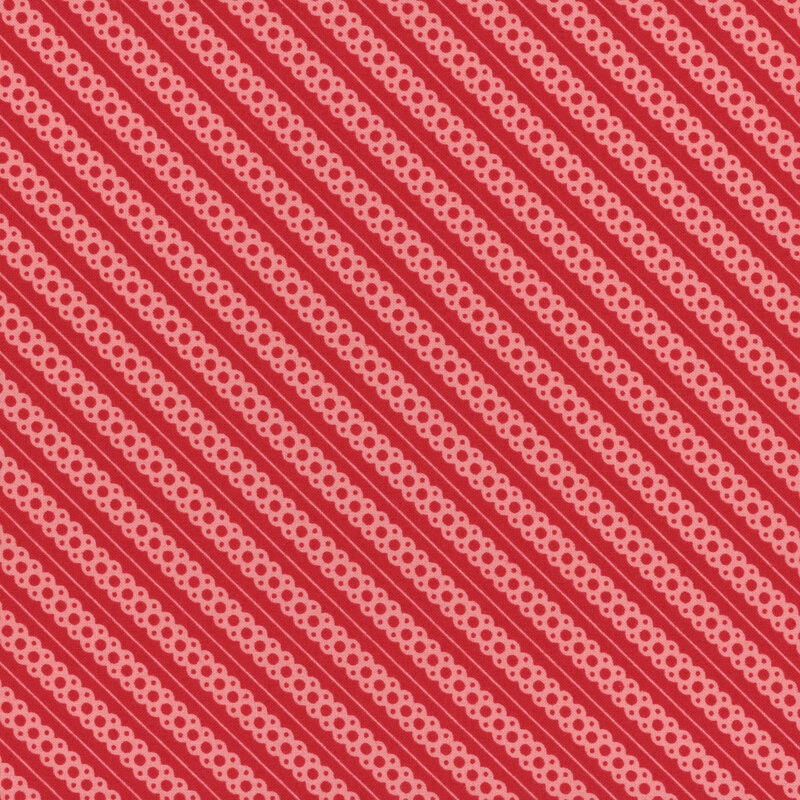 candy red fabric featuring pink diagonal scalloped lace stripes and thin pink striping accents