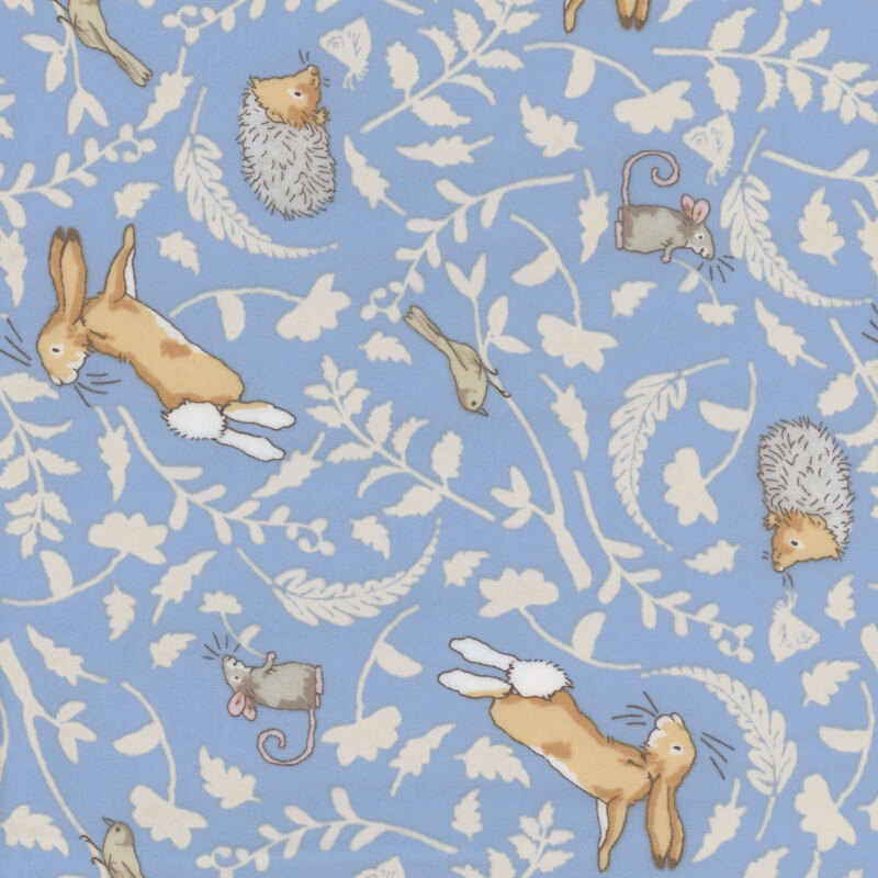 Denim Blue fabric featuring tonal leaf silhouettes and joyful woodland animals in soft, neutral colors.