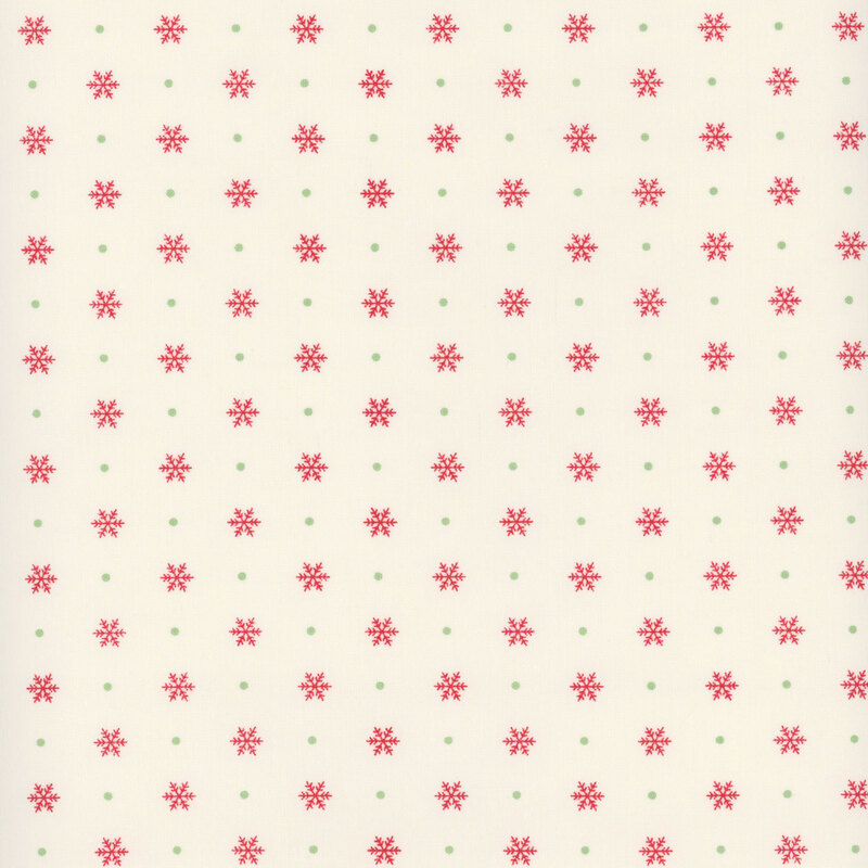 off white fabric featuring alternating candy red snowflakes and leaf green polka dots