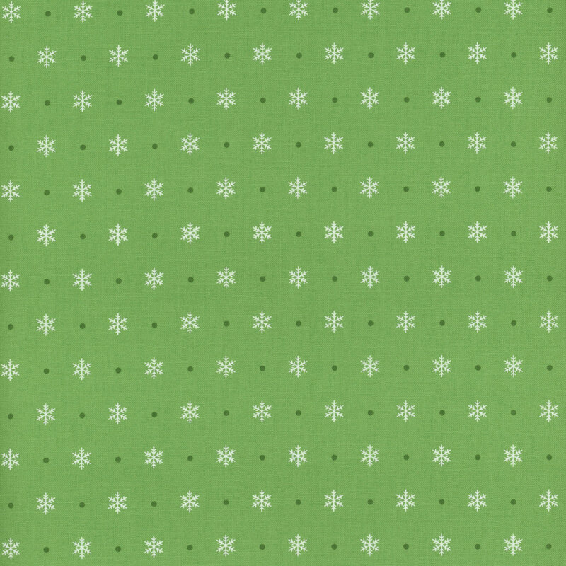 leaf green fabric featuring alternating off white snowflakes and deep green polka dots