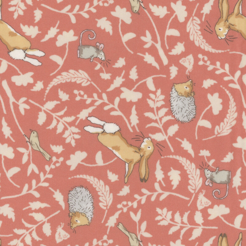 Coral fabric featuring tonal leaf silhouettes and joyful woodland animals in soft, neutral colors.